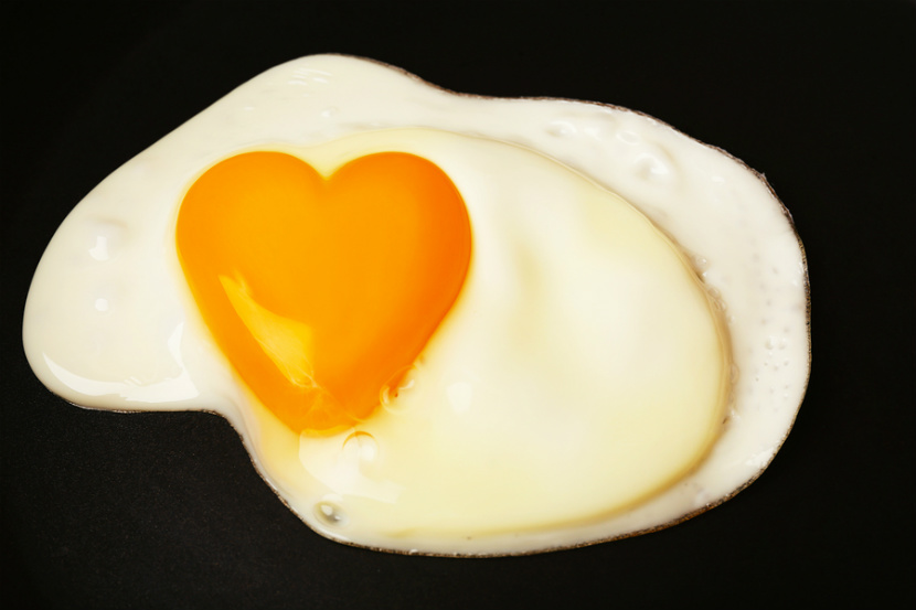 egg with a yolk in the shape of a heart