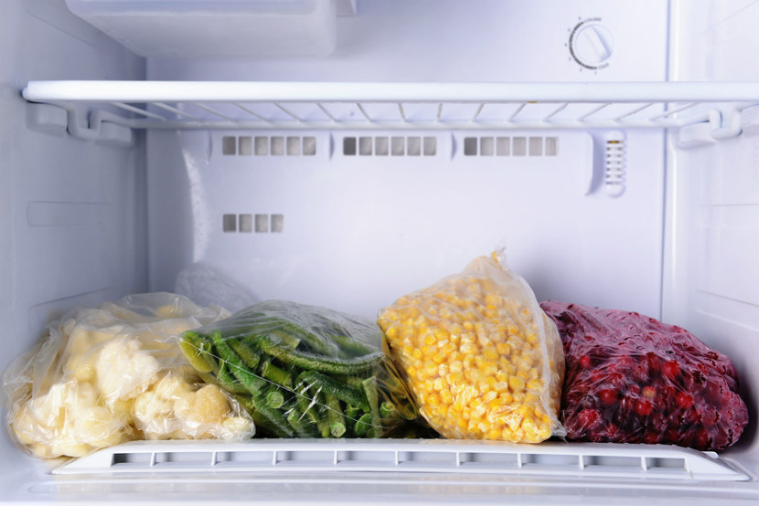frozen vegetables in bags in freezer